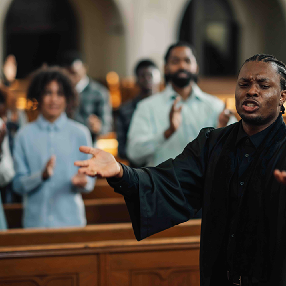 african-american-priest-leading-congregation-in-pr-2025-03-30-22-32-29-utc